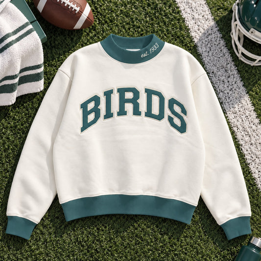 Birds Varsity Mockneck in Cream, color-corrected product view